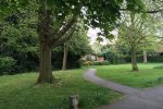 Photo 12: Park entrance has a slim hard footpath.